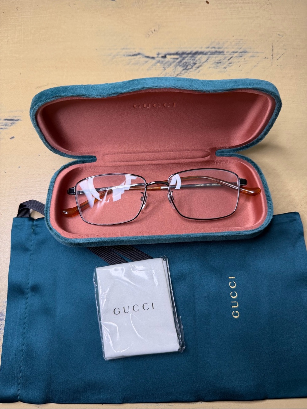 Gucci Gunmetal Frame Eyeglasses with Gold-Tone ear pads